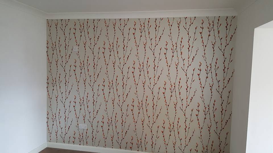 Delicate botanical patterned wallpaper on a feature wall